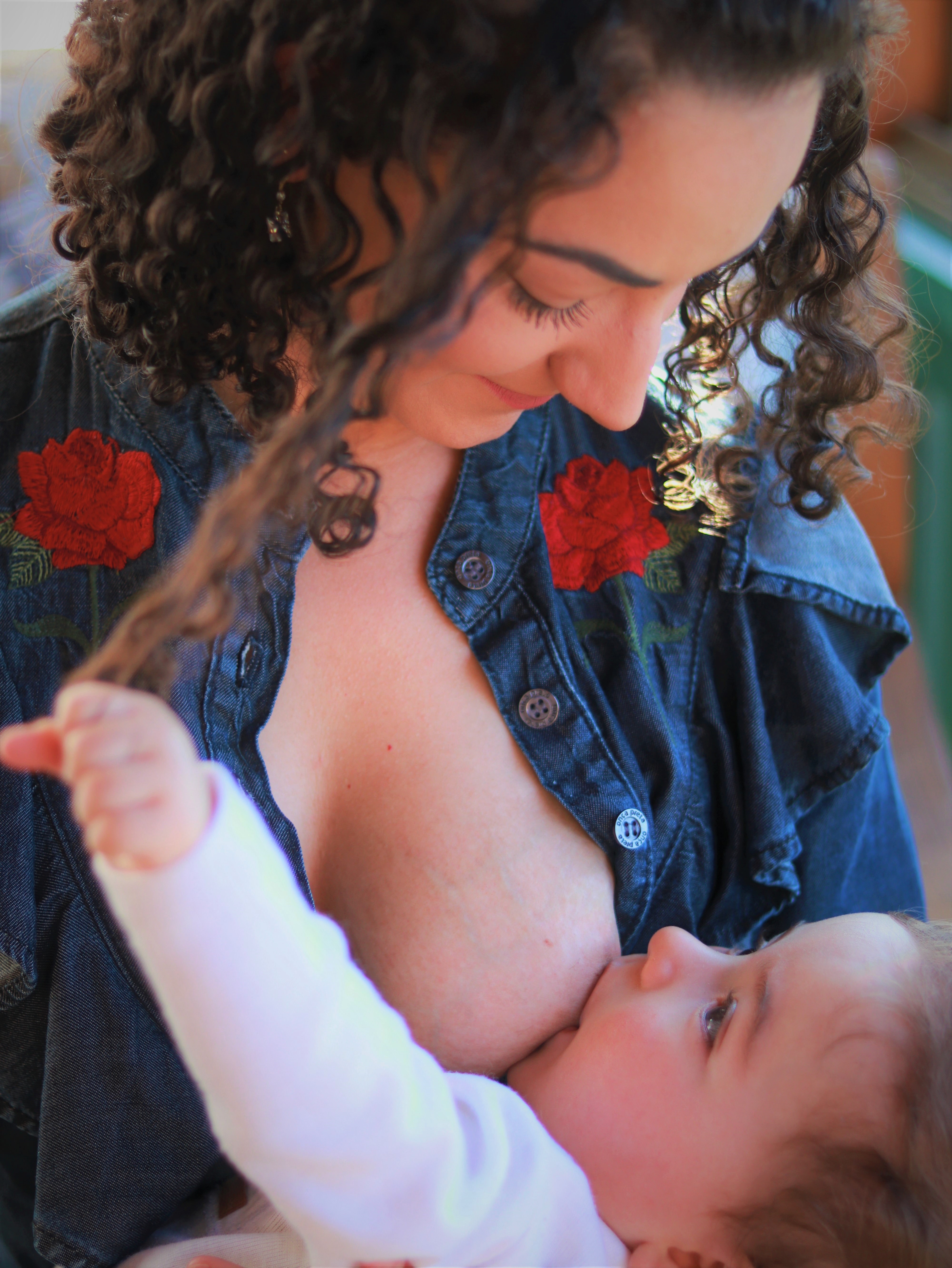 Lady nursing a baby