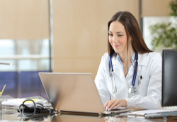 Medical student sitting at a computer