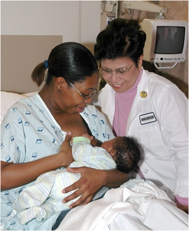 Lactation Consultant helping a mother nurse.