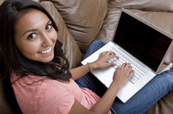 Student on laptop studying.