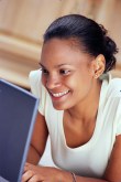 Lady smiling excited to be purchasing her course.