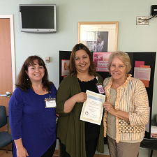 Amy and Vergie with an Intern graduate.