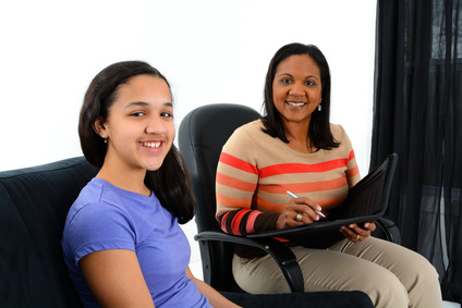 Young woman with older woman sitting